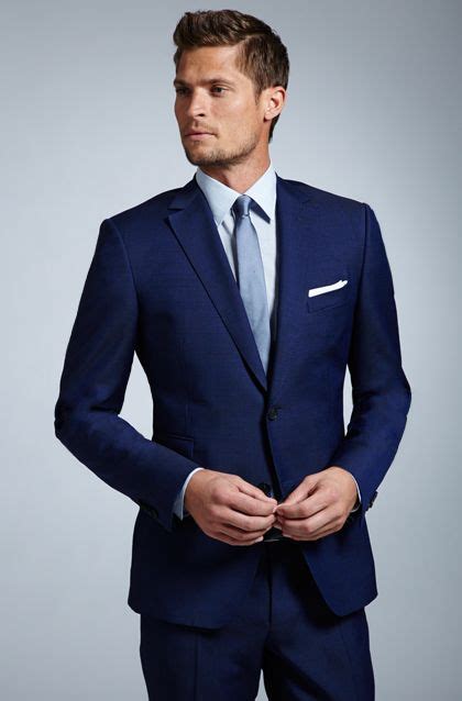 navy suit light blue tie.